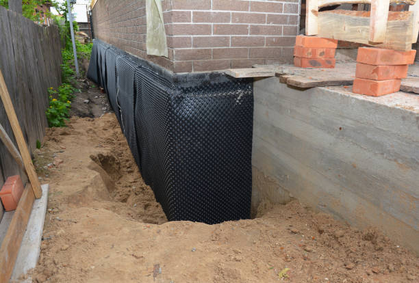 Happy homeowners after waterproofing job in Castleton
